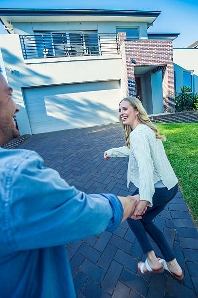 istock Couple joyfully running into their new home. 504222974