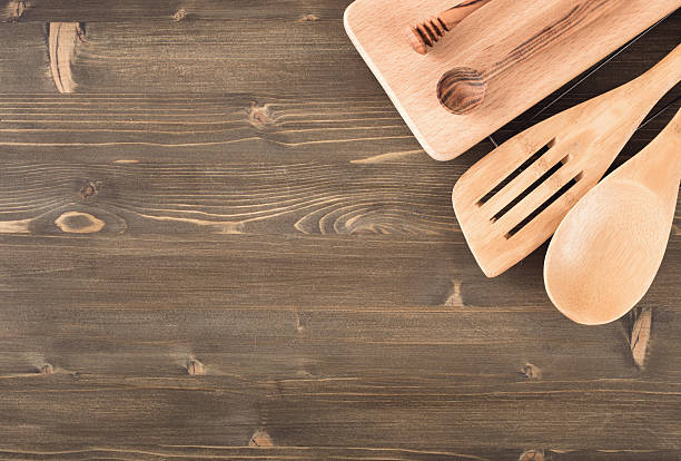 istock Kitchen utensils on wooden background 504223146