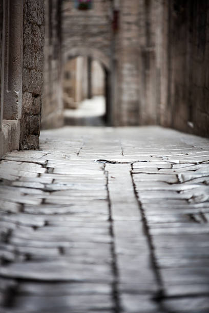 One of the ancient streets in the center downtown of Split (Croatia). Selective focus. Lower view.