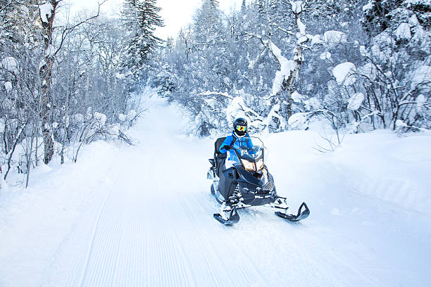 istock Woman on snowmobile 504224830