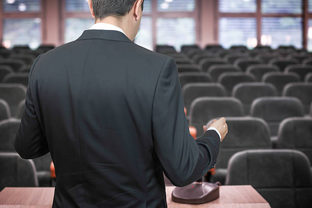istock Businessman practising his speech in emtry conference room 504224916