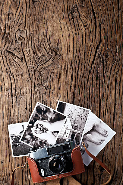 istock Old rangefinder camera and black-and-white photos. 504225232