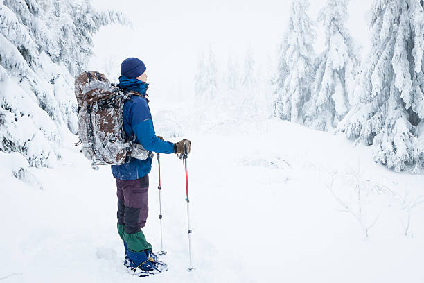istock mountaineer in winter mountains 504237081