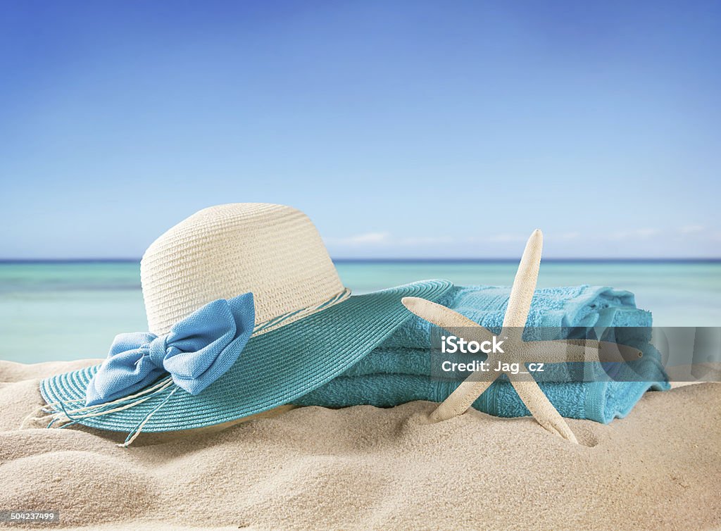 Sandy beach with accessories and blur sea Summer concept with swimming accessories and blur sea on background Beach Stock Photo