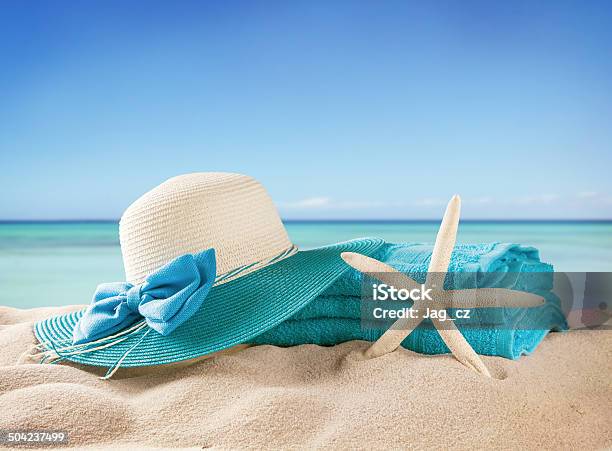 Sandy Beach With Accessories And Blur Sea Stock Photo - Download Image Now - Beach, Blue, Close-up