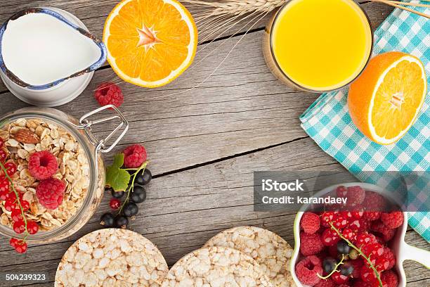 Healty Breakfast With Muesli Berries And Orange Juice Stock Photo - Download Image Now