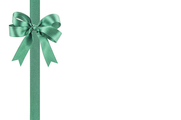 istock Green ribbon with a bow on white background 504240831