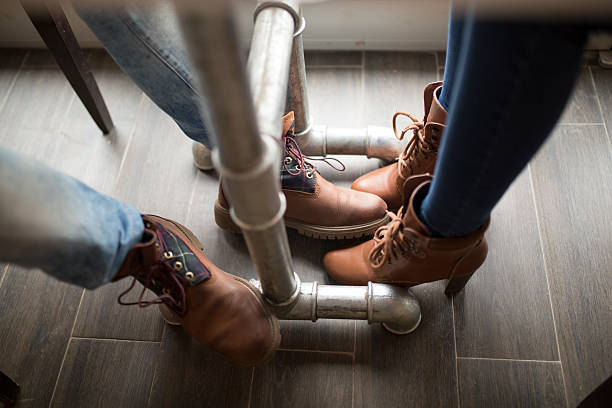 flirtation leg under table Distracted stock pictures, royalty-free photos & images