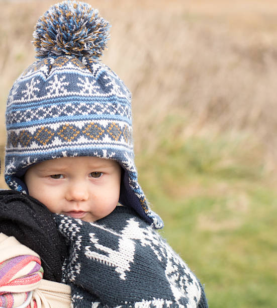 Toddler wrapped up on a winters day stock photo
