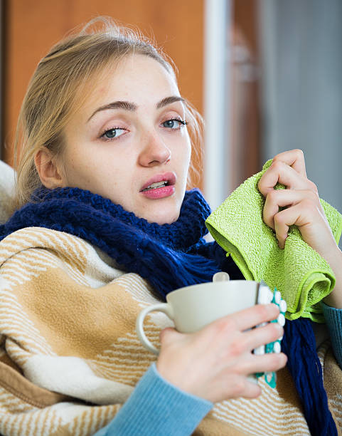 istock Young woman suffering of cold and having stuffy nose 504245366