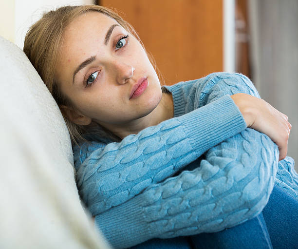 istock Upset girl in pullover feeling lonely at home 504245662