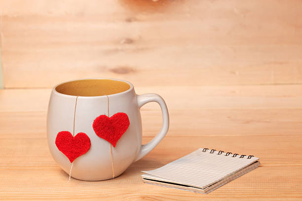 istock Cup of tea with hearts and note 504247454
