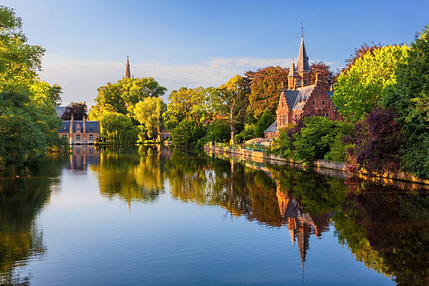The Minnewater of Bruges, Belgium The Minnewater (or Lake of Love), a fairytale scene in historic Bruges belgium stock pictures, royalty-free photos & images