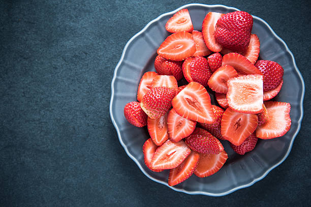 istock Fresh whole strawberries on plate 504250822
