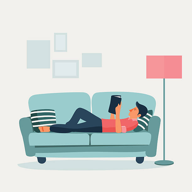 illustrazioni stock, clip art, cartoni animati e icone di tendenza di rilassata giovane uomo leggendo un libro su un divano - reading book men sofa