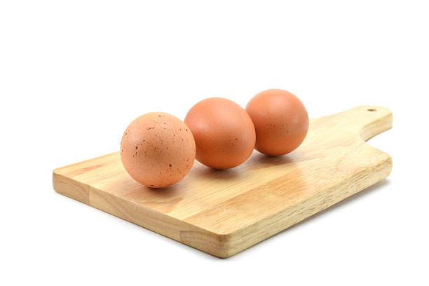istock three eggs in wooden on white background 504251516