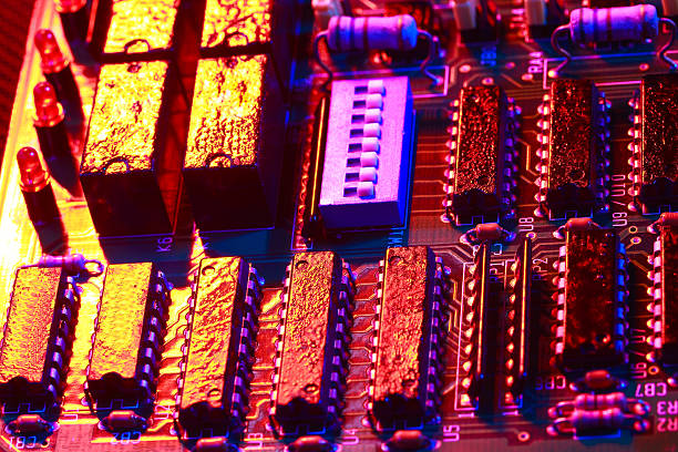 istock Gold yellow with red light of circuit board with processor close-up 504253254