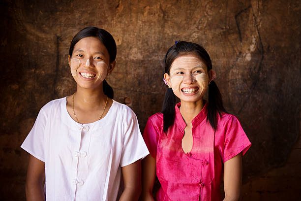 istock Two happy young Myanmar girls 504253636