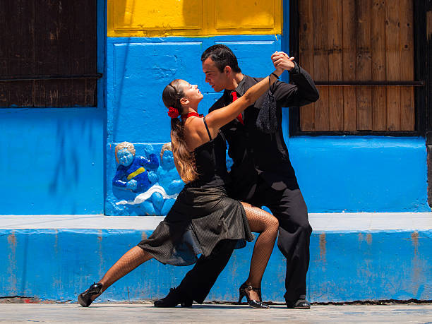 Street performers in Buenos Aires, Argentina Buenos Aires, Argentina - December 15, 2009: Street performers demonstrate the tango in the historical district of La Bocca in Buenos Aires, Argentina. argentinian ethnicity photos stock pictures, royalty-free photos & images