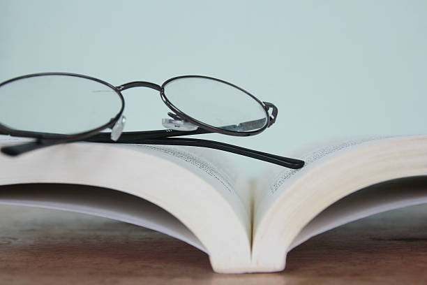 istock pile of reading books and spectacles 504257128