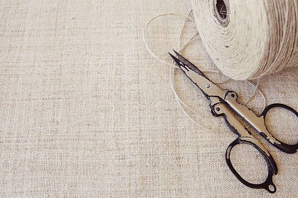 istock Rustic scissors and twine copy space background, vintage tone 504257400