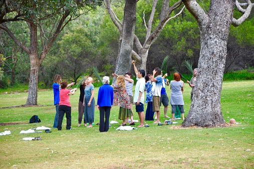 Hamilton Hill,WA,Australia-October 10, 2015: People performing a spiritual ritualistic ceremony in Manning Park nature setting in Western Australia.
