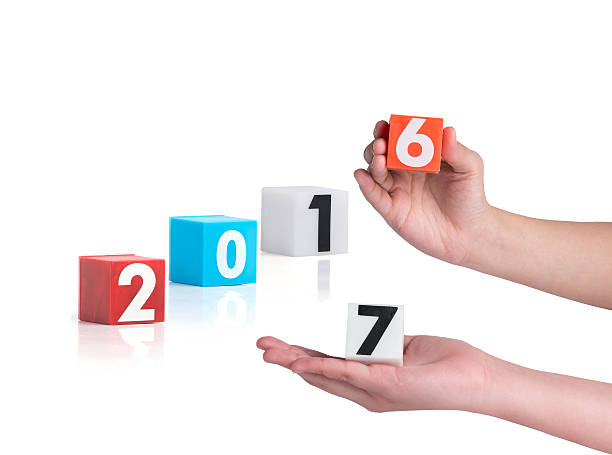 istock hand holding colorful plastic of year numbers on a white 504257580
