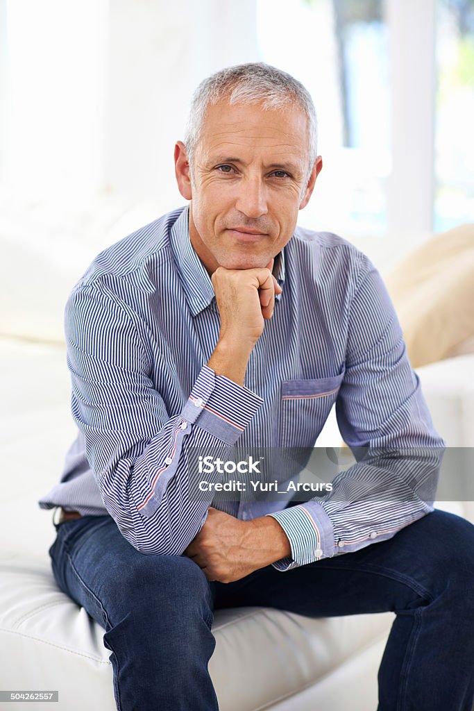 Attitude is everything Portrait of a thoughtful mature man sitting on a sofa 40-49 Years Stock Photo