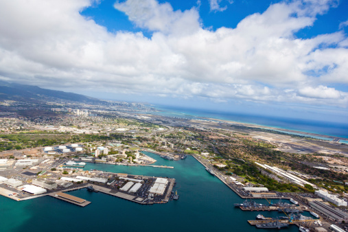 Aerial view of Honolulu, Hawaii, on an overcast and rainy day. Focus on Pearl Harbor.