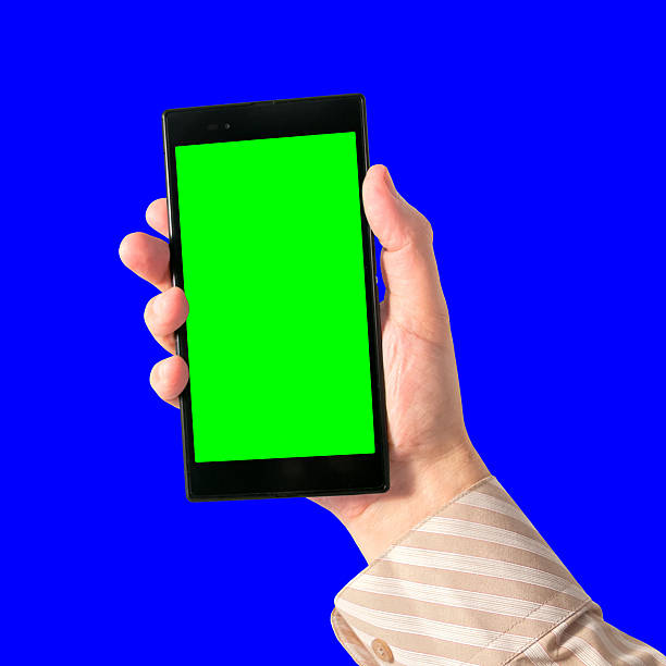 istock Man holds in hand touchscreen tablet with chroma key 504263707