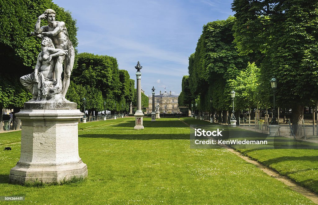 Luxembourg Gardens Statues, columns , lampposts and manicured grounds of the Luxembourg Gardens, the second largest public park in Paris,France. The park is the garden of the French Senate, which is itself housed in the Luxembourg Palace in the background. Paris - France Stock Photo