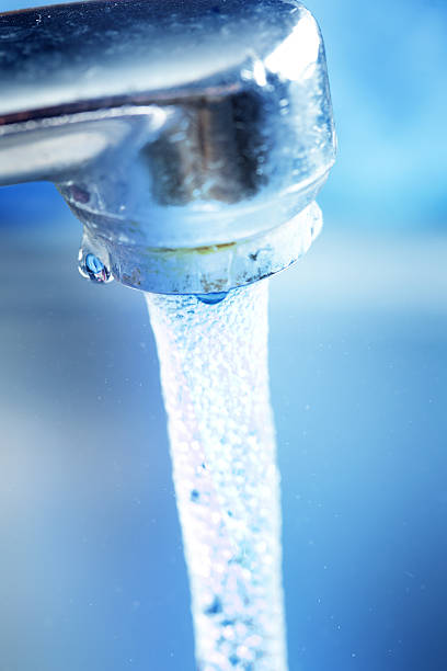 istock running water from bathroom faucet 504267187