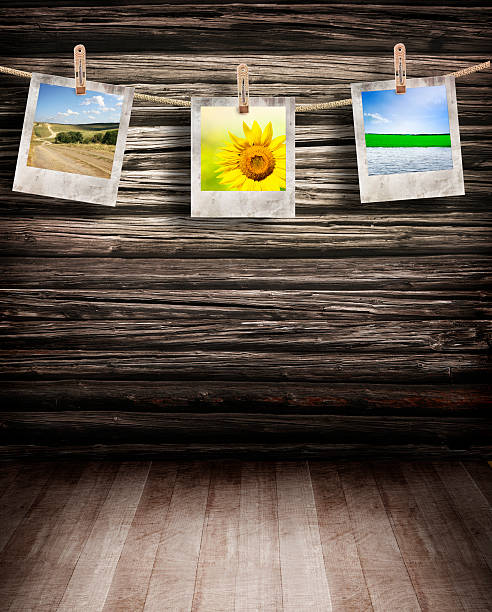 istock Pictures hanging on wooden background 504268345
