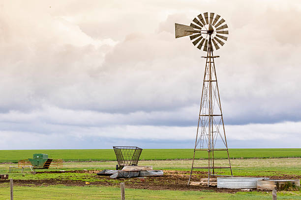 istock Windmill standing in country field 504273540