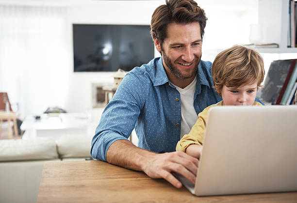 istock Showing him the ways of the internet 504274804