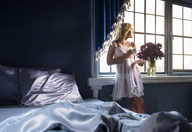 красивая женщина в спальне - waking up women bedding underwear стоковые фото и изображения
