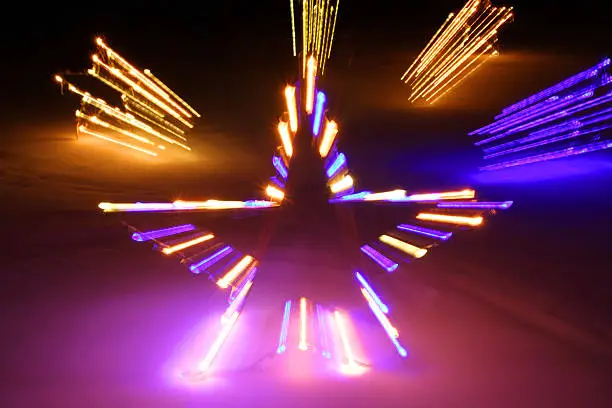 A long exposure of Christmas lights shaped like a star