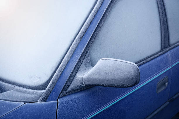 istock Car window and side mirror covered with ice in the 504276816
