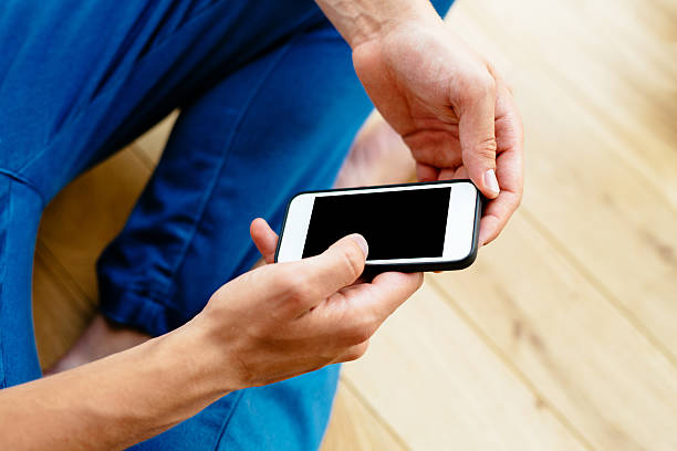 istock Mockup of man holding smartphone 504279430