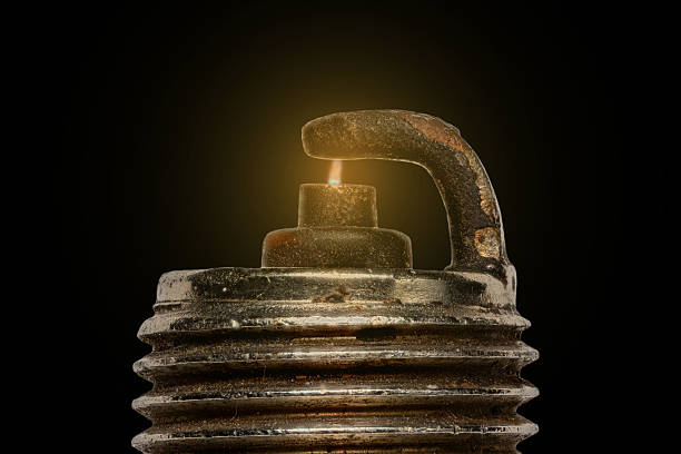 Extreme magnification - Spark plug firing stock photo