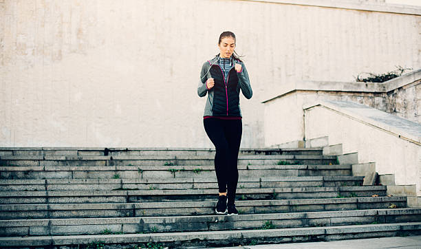 istock Woman Running Down The Stairs 504283110