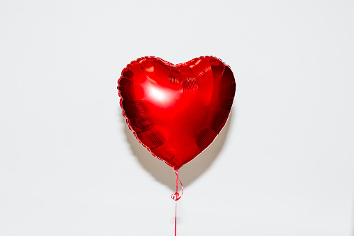 Red heart shaped helium balloon