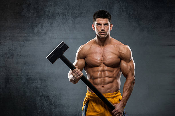istock Male athlete holding a hammer 504283460