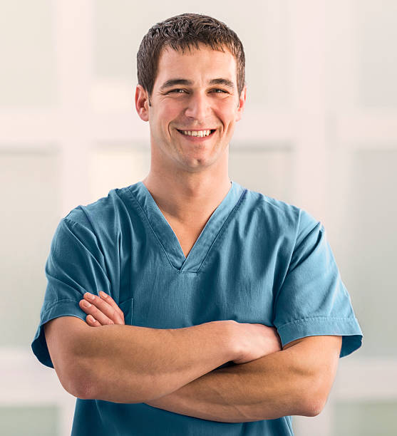 istock Smiling surgeon with arms crossed looking at camera. 504283548