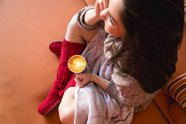 Girl in bed with coffee cup