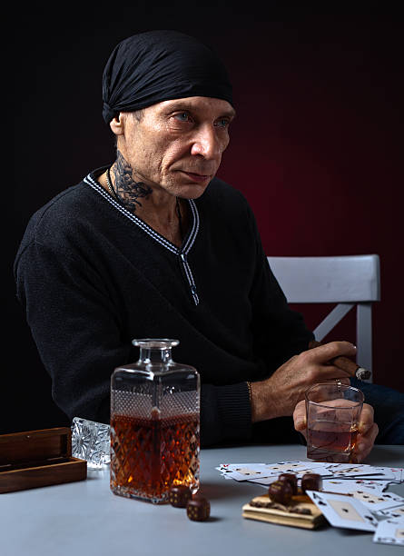 istock player with whiskey and cigar 504286374