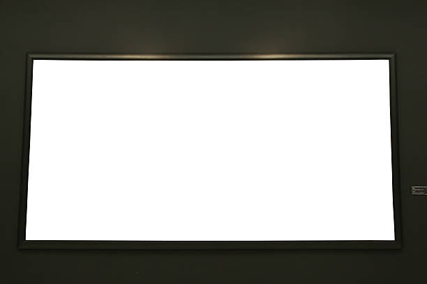 istock Blank black painting frame on black wall 504287711