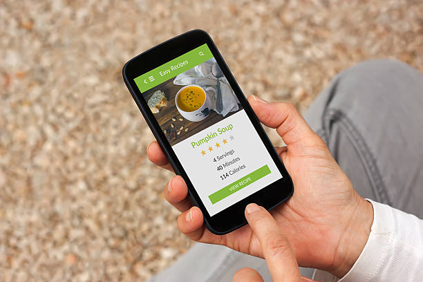 istock Hands holding smartphone with food application mock up on screen. 504287760