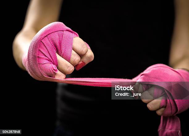 Woman Is Wrapping Hands With Pink Boxing Wraps Stock Photo - Download Image Now - Women, Boxing - Sport, Pink Color