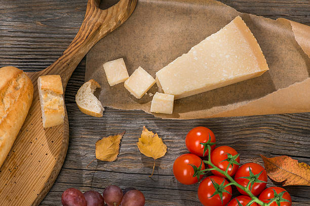 istock Italian cheese sliced on the wooden table 504288080